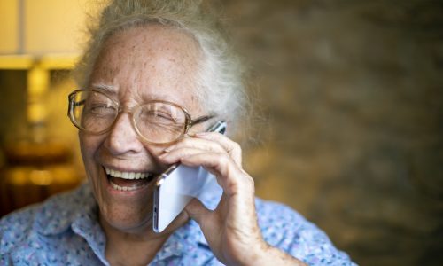 happy-senior-woman-talking-on-the-phone-2LAY4V6